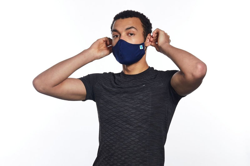 Man wearing a navy face mask by Carrington Textiles